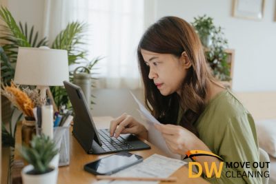 person-checking-on-the-computer-7-things-to-do-before-hiring-a-professional-move-out-cleaning-service-in-singapore-move-out-cleaning-dw-move-out-cleaning-singapore